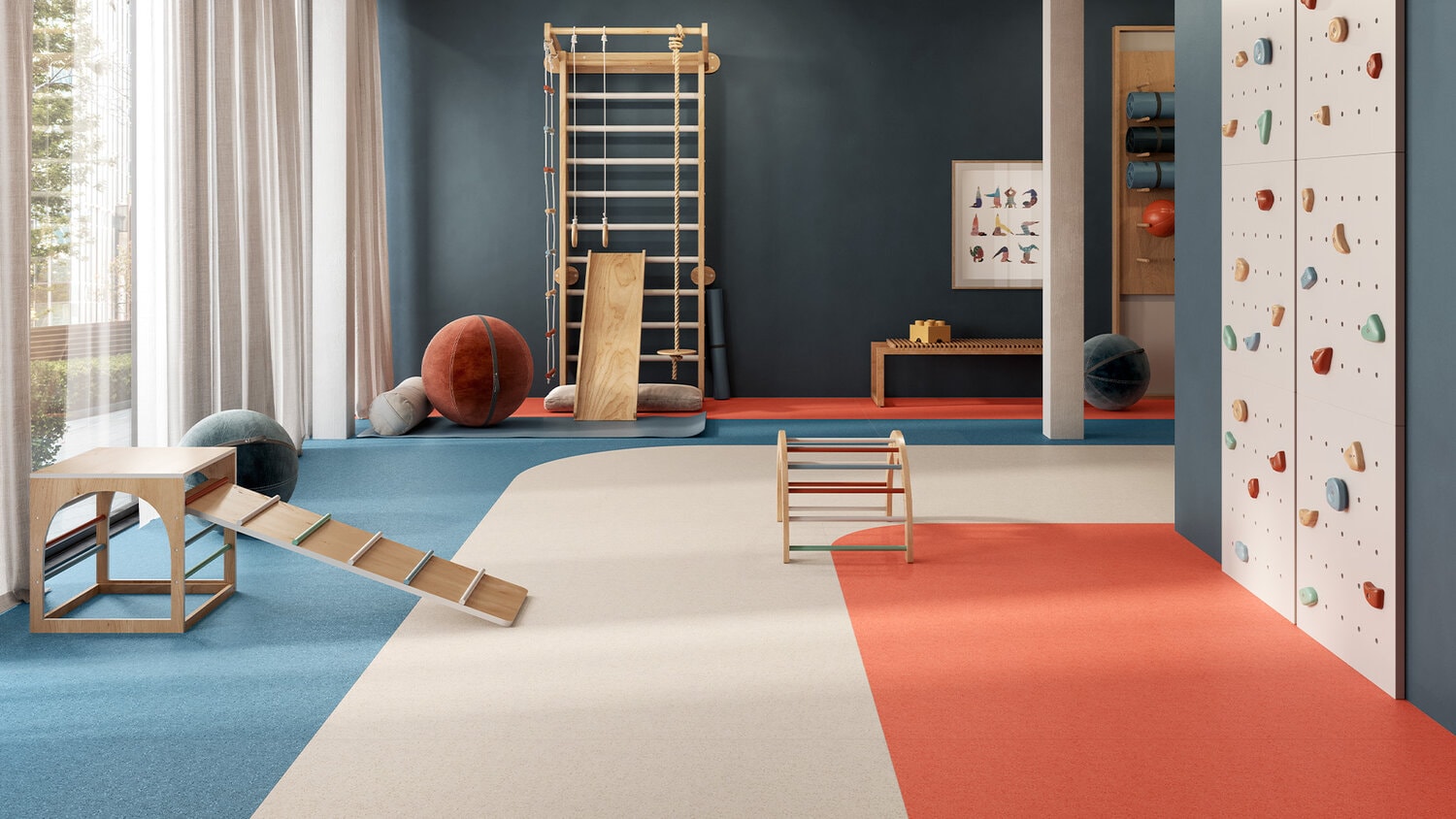Colorful activity room with functional flooring, climbing elements and sports equipment. The elastic floor covering is especially suitable for educational facilities and multifunctional interiors.